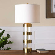 Uttermost Angora Brushed Brass Metal and Acrylic Table Lamp With Light Beige Linen Drum Shade