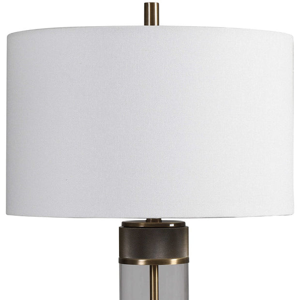 Uttermost Anmer Clear Glass and Antiqued Brass Iron Table Lamp With White Drum Shade